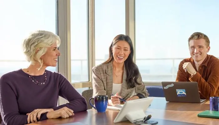 Colleagues sitting around a table in a meeting
